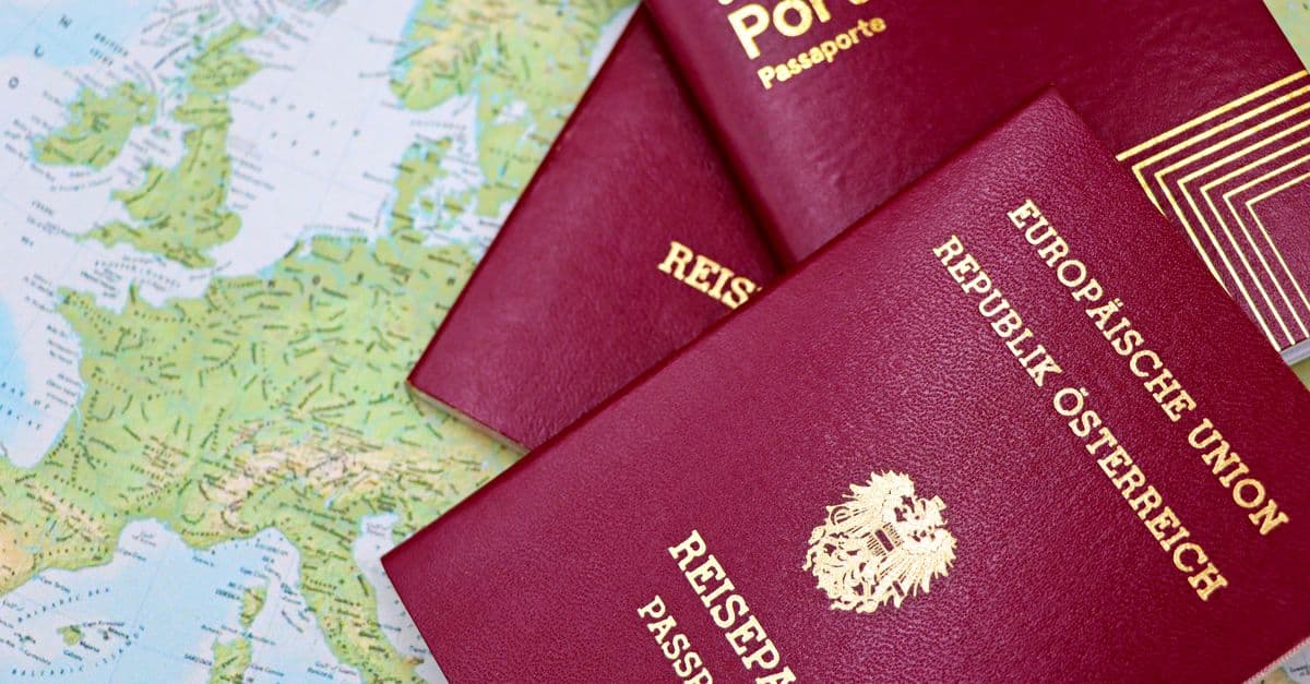 European passports laid on a map of Europe
