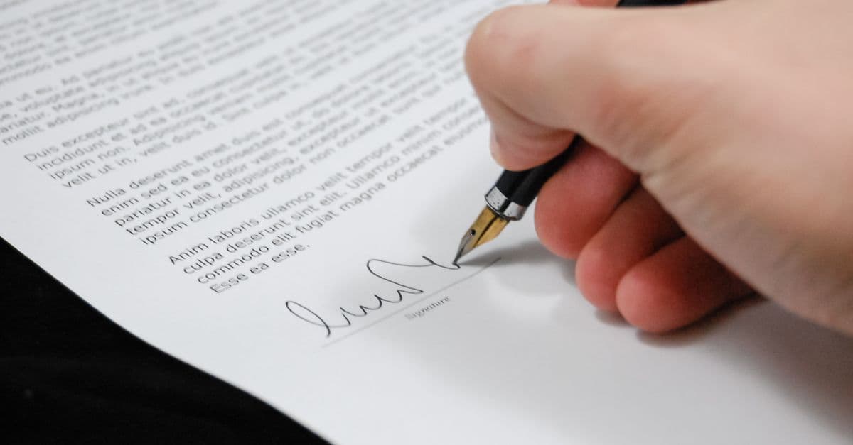 Fountain pen signing a legal document